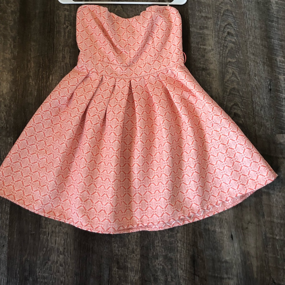 Beautiful strapless pink dress with detail.